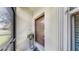 Inviting front door with plant accent and screen door for fresh air at 334 Mystic Falls Dr, Apollo Beach, FL 33572