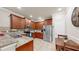 Open kitchen featuring granite counters, stainless steel appliances, and a breakfast bar at 334 Mystic Falls Dr, Apollo Beach, FL 33572