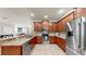 Spacious kitchen with stainless steel appliances, granite countertops, and ample storage at 334 Mystic Falls Dr, Apollo Beach, FL 33572