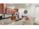 Kitchen boasts granite countertops, stainless appliances, and a convenient breakfast bar at 334 Mystic Falls Dr, Apollo Beach, FL 33572