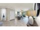 Inviting living room with neutral tones, tile floors, and sliding glass doors to the lanai at 334 Mystic Falls Dr, Apollo Beach, FL 33572