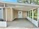 Charming home featuring a screened-in porch and covered carport, perfect for enjoying the outdoors at 34141 Tree Lake Dr, Wesley Chapel, FL 33543