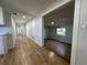 Hallway showcasing new flooring, neutral paint, and white trim at 34141 Tree Lake Dr, Wesley Chapel, FL 33543
