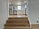 Open view of the kitchen featuring stainless steel appliances, white cabinets, and an eat-in space at 34141 Tree Lake Dr, Wesley Chapel, FL 33543
