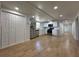 Newly renovated kitchen featuring stainless steel appliances, white cabinets and wood floors at 34141 Tree Lake Dr, Wesley Chapel, FL 33543