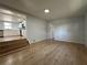 The living room connects to the kitchen with hardwood flooring at 34141 Tree Lake Dr, Wesley Chapel, FL 33543