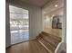 The living room connects to the screened porch and kitchen at 34141 Tree Lake Dr, Wesley Chapel, FL 33543