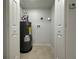 The utility room includes a new hot water heater and hookups for a washer and dryer at 34141 Tree Lake Dr, Wesley Chapel, FL 33543