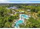 An aerial view showcases the community's pools, clubhouse, and surrounding green spaces at 4194 Bexley Village Dr, Land O Lakes, FL 34638