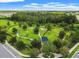 A picturesque dog park featuring lush greenery, shade trees, and walking paths at 4194 Bexley Village Dr, Land O Lakes, FL 34638