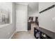 Bright entryway featuring a view into an open-concept kitchen and dining area, with neutral decor at 4194 Bexley Village Dr, Land O Lakes, FL 34638