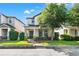 Charming two-story home featuring a covered porch, well-manicured landscaping, and a brick pathway at 4194 Bexley Village Dr, Land O Lakes, FL 34638