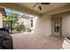 This screened-in patio features brick pavers and ceiling fan, perfect for enjoying the outdoors at 4194 Bexley Village Dr, Land O Lakes, FL 34638