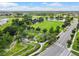 Aerial view of recreation area with sports field and bike park near walking trails and street at 4194 Bexley Village Dr, Land O Lakes, FL 34638