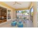 Relaxing balcony with comfortable seating overlooking the backyard, accessible from bedroom at 4301 W Swann Ave, Tampa, FL 33609