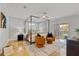 Bright bedroom features a stylish four-poster bed, seating area, and balcony access at 4301 W Swann Ave, Tampa, FL 33609