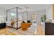 Bright bedroom boasts a stylish four-poster bed, seating, and access to a private balcony at 4301 W Swann Ave, Tampa, FL 33609