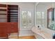 Well-organized closet featuring custom shelving, drawers, and a built-in vanity area at 4301 W Swann Ave, Tampa, FL 33609