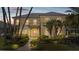 Elegant two-story home showcasing manicured landscaping, and inviting front entrance at 4301 W Swann Ave, Tampa, FL 33609