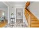 Grand entryway with wooden staircase and elegant marble flooring at 4301 W Swann Ave, Tampa, FL 33609