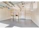 Spacious garage featuring epoxy flooring, built-in cabinets, and ample storage space at 4301 W Swann Ave, Tampa, FL 33609