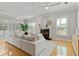 Bright living room features hardwood floors, a fireplace, and French doors to the pool at 4301 W Swann Ave, Tampa, FL 33609