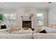 Cozy living room features fireplace, windows, and plush seating at 4301 W Swann Ave, Tampa, FL 33609