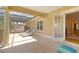 Inviting outdoor patio with lounge chairs and access to both the pool and home interior at 4301 W Swann Ave, Tampa, FL 33609