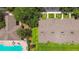 Aerial view of townhomes showcasing well-maintained grounds and nearby pool area at 4516 Barnstead Dr, Riverview, FL 33578