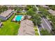 Aerial view of community pool and surrounding residential area with green landscaping at 4516 Barnstead Dr, Riverview, FL 33578