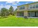 Backyard featuring lush green lawn, patio, and exterior building at 4516 Barnstead Dr, Riverview, FL 33578