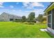 A lush backyard offers ample space for outdoor enjoyment, privacy landscaping, and a community pool at 4516 Barnstead Dr, Riverview, FL 33578