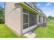 The backyard boasts a screened patio with exterior access and lush landscaping creating an inviting outdoor space at 4516 Barnstead Dr, Riverview, FL 33578