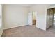 Bright bedroom featuring neutral carpet, light walls and bathroom access at 4516 Barnstead Dr, Riverview, FL 33578