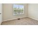 Bedroom featuring neutral carpet and a window overlooking the neighborhood at 4516 Barnstead Dr, Riverview, FL 33578