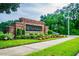 Charming Valhalla community entrance sign on a decorative brick wall with flowerbeds at 4516 Barnstead Dr, Riverview, FL 33578