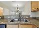 Close up on granite countertops and stainless double sinks at 4516 Barnstead Dr, Riverview, FL 33578