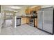 Bright kitchen featuring stainless steel appliances and view to living room at 4516 Barnstead Dr, Riverview, FL 33578