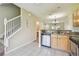 Kitchen featuring stainless appliances, granite counters, and view of staircase at 4516 Barnstead Dr, Riverview, FL 33578