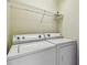 Laundry Room featuring a washer, dryer and storage shelf at 4516 Barnstead Dr, Riverview, FL 33578