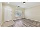 Inviting living room featuring modern flooring, neutral paint, and a bright window at 4516 Barnstead Dr, Riverview, FL 33578