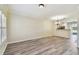Spacious living area with new flooring, leading to an open kitchen and bright spaces at 4516 Barnstead Dr, Riverview, FL 33578