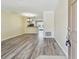 Open living space with modern flooring, seamlessly connecting to the kitchen at 4516 Barnstead Dr, Riverview, FL 33578
