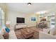 Bright living room featuring stylish decor, a dining area, and an open kitchen layout at 4516 Barnstead Dr, Riverview, FL 33578