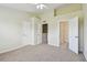 Bright main bedroom featuring neutral colors, a ceiling fan, a walk-in closet and an ensuite bathroom at 4516 Barnstead Dr, Riverview, FL 33578