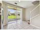 Bright dining area with staircase and sliding glass doors to outside at 4516 Barnstead Dr, Riverview, FL 33578
