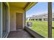 Screened-in patio with a lush green lawn view and exterior door at 4516 Barnstead Dr, Riverview, FL 33578