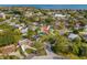 Aerial view of a house with a pool, highlighting its proximity to the bay and surrounding neighborhood amenities at 4601 Venetian Ne Blvd, St Petersburg, FL 33703