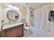 Standard bathroom with single sink vanity and a shower-tub combo with tile surround and modern fixtures at 4916 Chatham Gate Dr, Riverview, FL 33578
