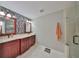 Bathroom featuring double vanity, attractive mirror and lighting, glass shower, and tile flooring at 4916 Chatham Gate Dr, Riverview, FL 33578